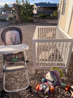 Baby crib, toy, and chair