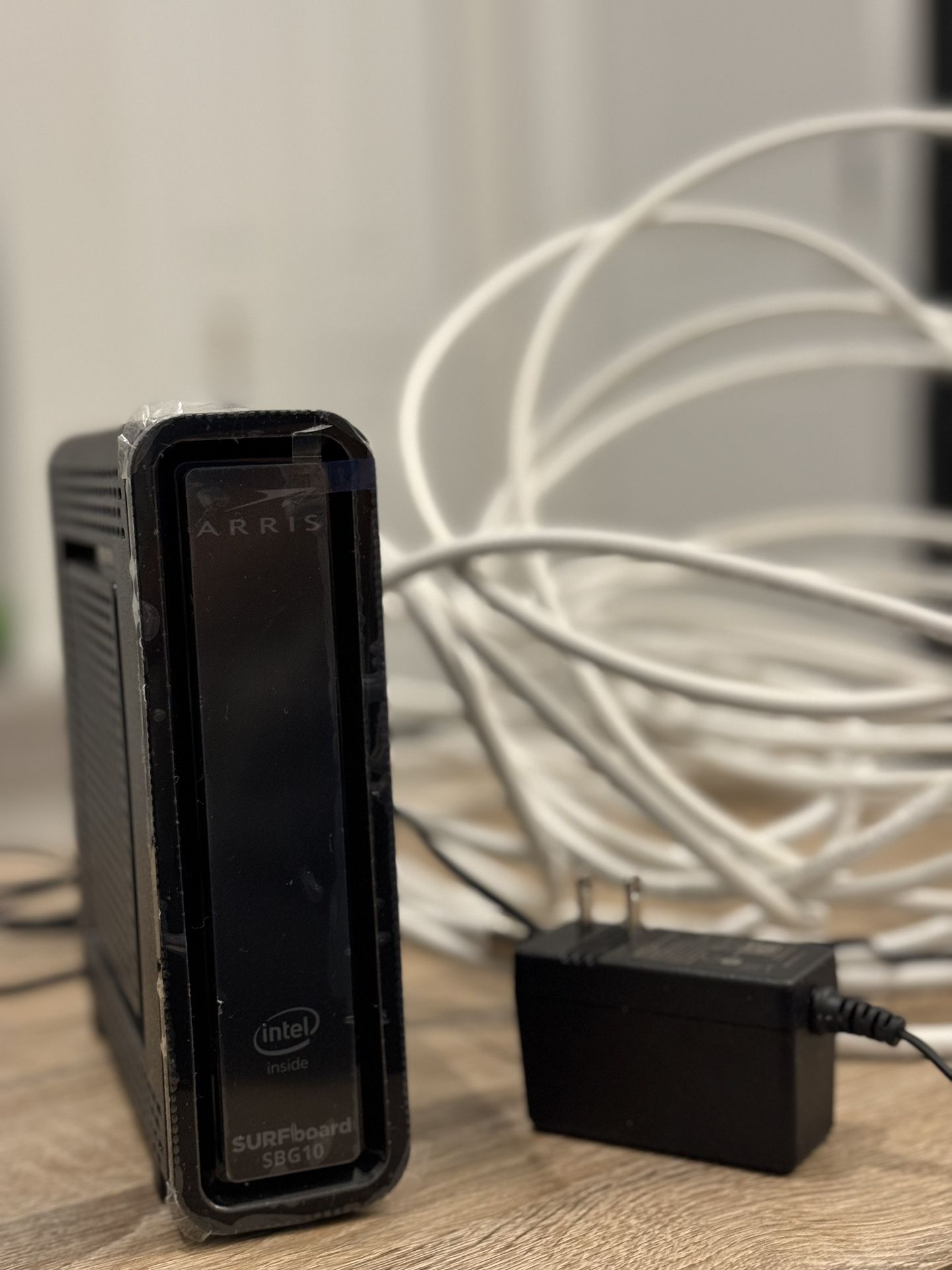 ARRIS SURFboard SBG10 DOCSIS 3.0 16 x 4 Gigabit Cable Modem & AC1600 Wi-Fi Router , Comcast Xfinity, Cox, Spectrum , Two 1 Gbps Ports , 400 Mbps Max I