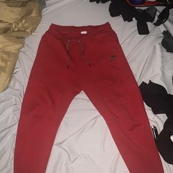 Red Nike tech pants size L