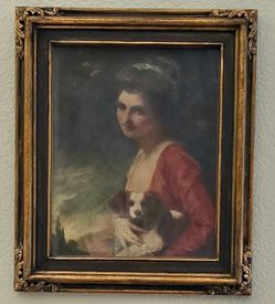 Vintage wood frame with scroll edges and linen matting. Portrait of girl with dog