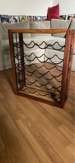 Wine rack cast iron and wood heavy holds 20 as is pick up deliver.