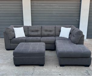 Gray L shaped sectional with ottoman