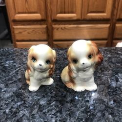 Vintage ceramic Pair of Salt and Pepper Shaker with stoppers.  Very cute dogs.  Size 3 inches tall.  Preowned Excellent condition.  Has been on displa