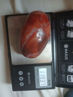 119 gram of carnelian palm stone