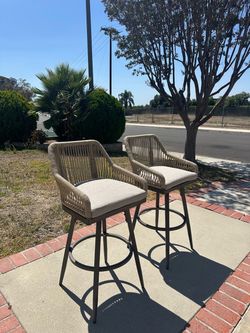 360° Swivel Aluminum and Wicker Bar Stools (Set of 2) – $100