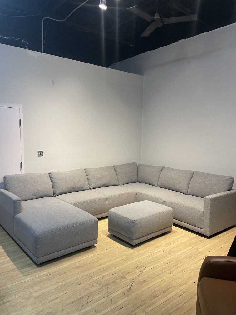 Used large gray sectional sofa couch with ottoman