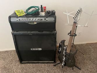 Line 6 Spider MKII with 4x12 cabinet. Washburn guitar with Floyd Rose and locking head.