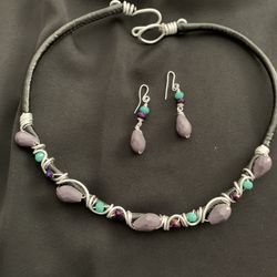 Jewelry 4 necklace and earring set selling together.  The beads are turquoise, purple and lavender. 