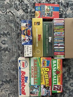 Over probably 15,000 baseball cards from Topps,Fleer, Donruss, upper deck from the 80’s, 90’s and 2000’s. Sealed packs, complete sets, factory sets an