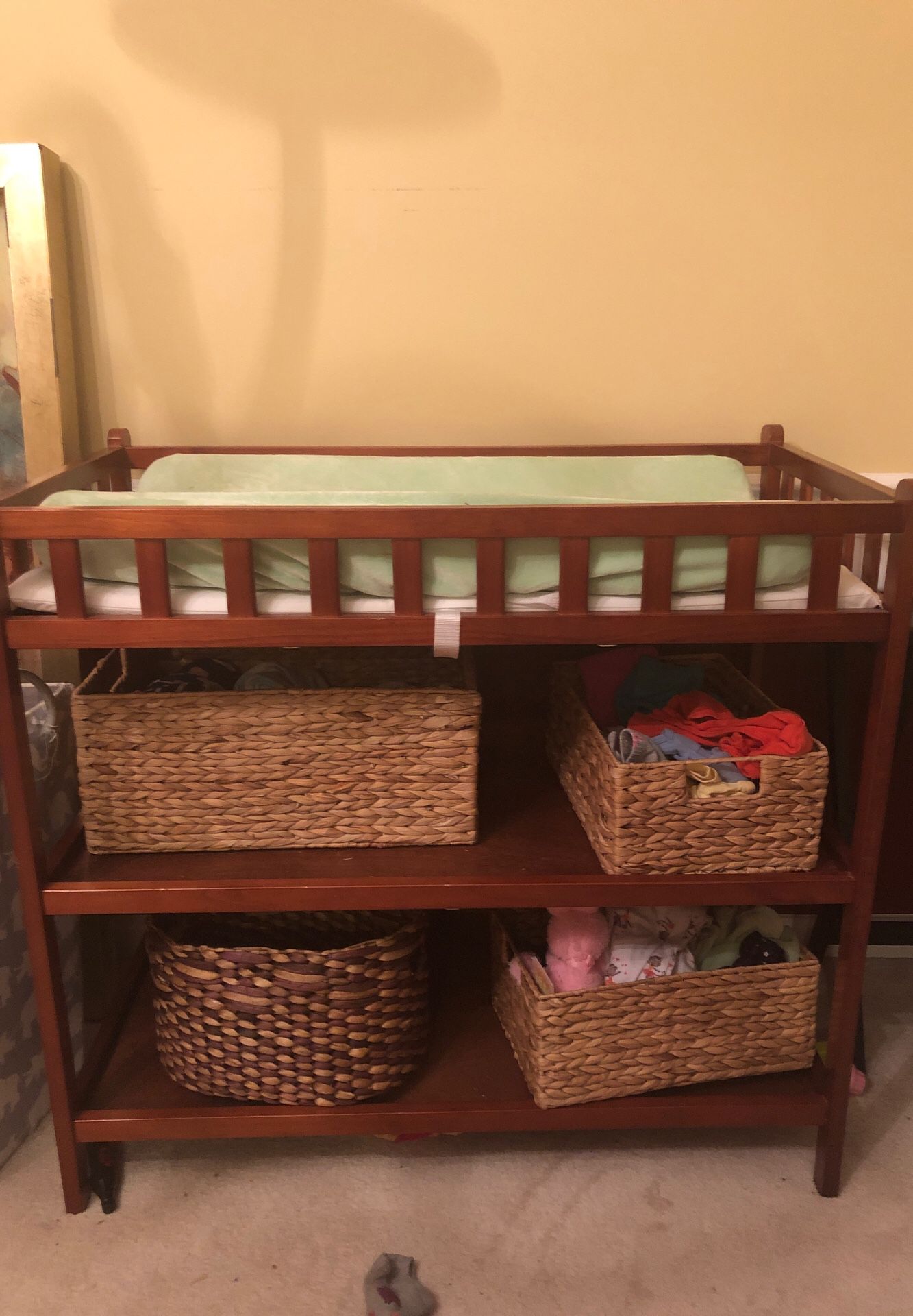 Changing table and storage baskets.
