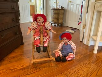Raged Ann and Andy dolls with rocking horse