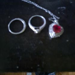 Engagement Ring And Band And Heart Necklaces 