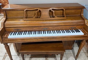 Wooden piano + chair