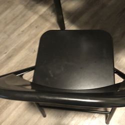 3 Folded Black Chairs