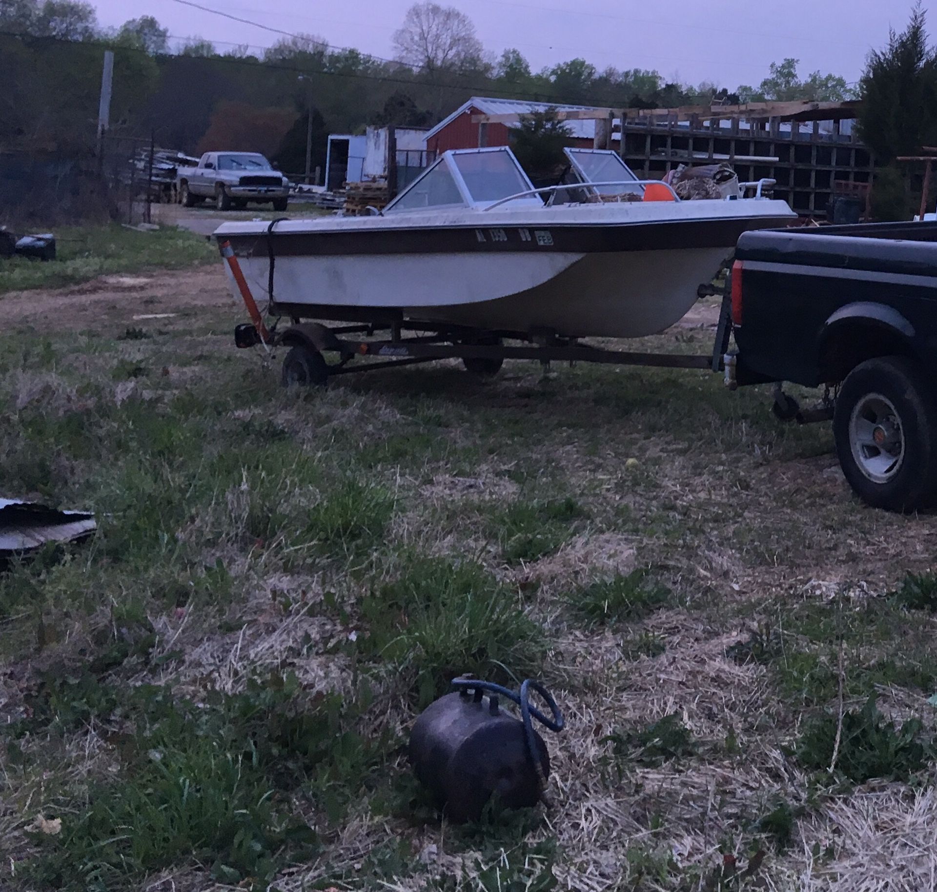 Photo Fiberglass boat and trailer