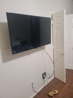 65” Wall Mounted TCL Flat Panel TV w/Roku