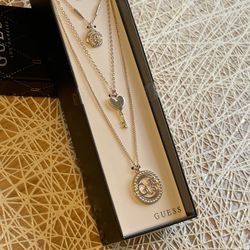 Guess Multi chain neckless and earring set in a Box