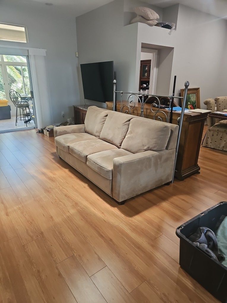 3 Seat Tan Couch With Hide-bed