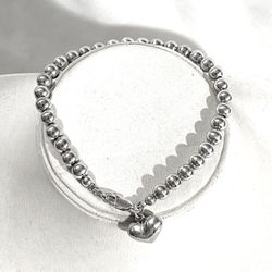 Brand new .925 silver bead strand bracelet with silver heart pendant