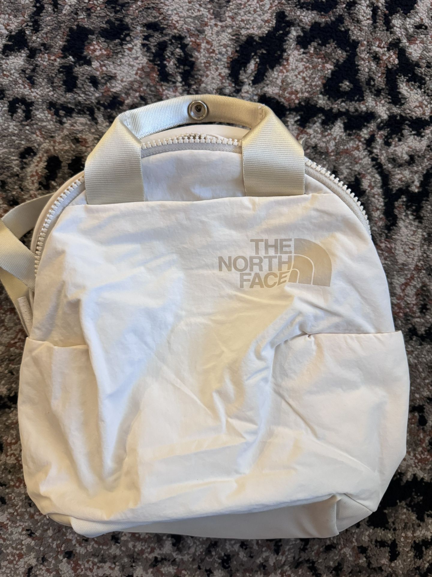The North Face Mini White Puffy Backpack