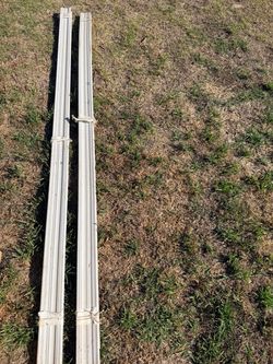 Two bundles of unused baseboard