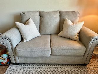 Signature Design by Ashley Tan Sofa and Loveseat