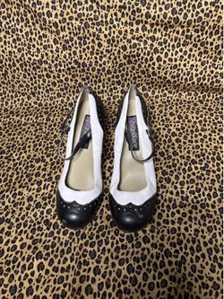 Unique vintage black and white pumps
