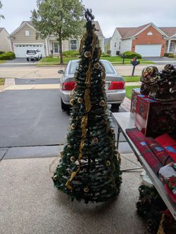 Pop Up Christmas Tree. 5 feet. Pre Lit, Has Ornaments Attached & Gold Ribbon. Ready To Go. Fits In A Narrow Tall Box.