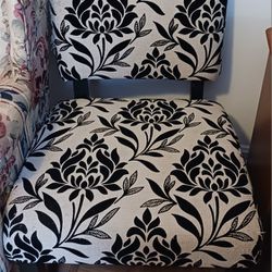 BLACK AND TAN PATTERNED SLIPPER CHAIR, PRICE REFLECTS SOME CAT SCRATCHING ON THE FABRIC 