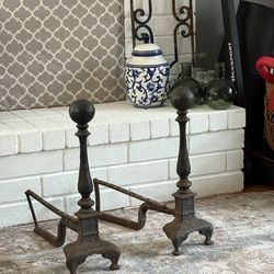 Those are andirons. (fire dogs).