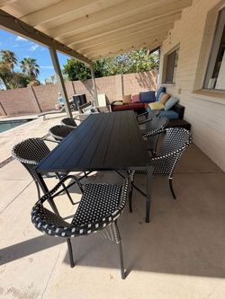 Outdoor Black metal table and 7 chairs for $200!!! Pick up today