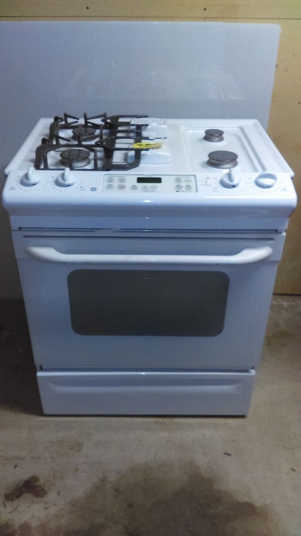 Very nice white gas GE slide in range. Dimensions are 32 inches wide by