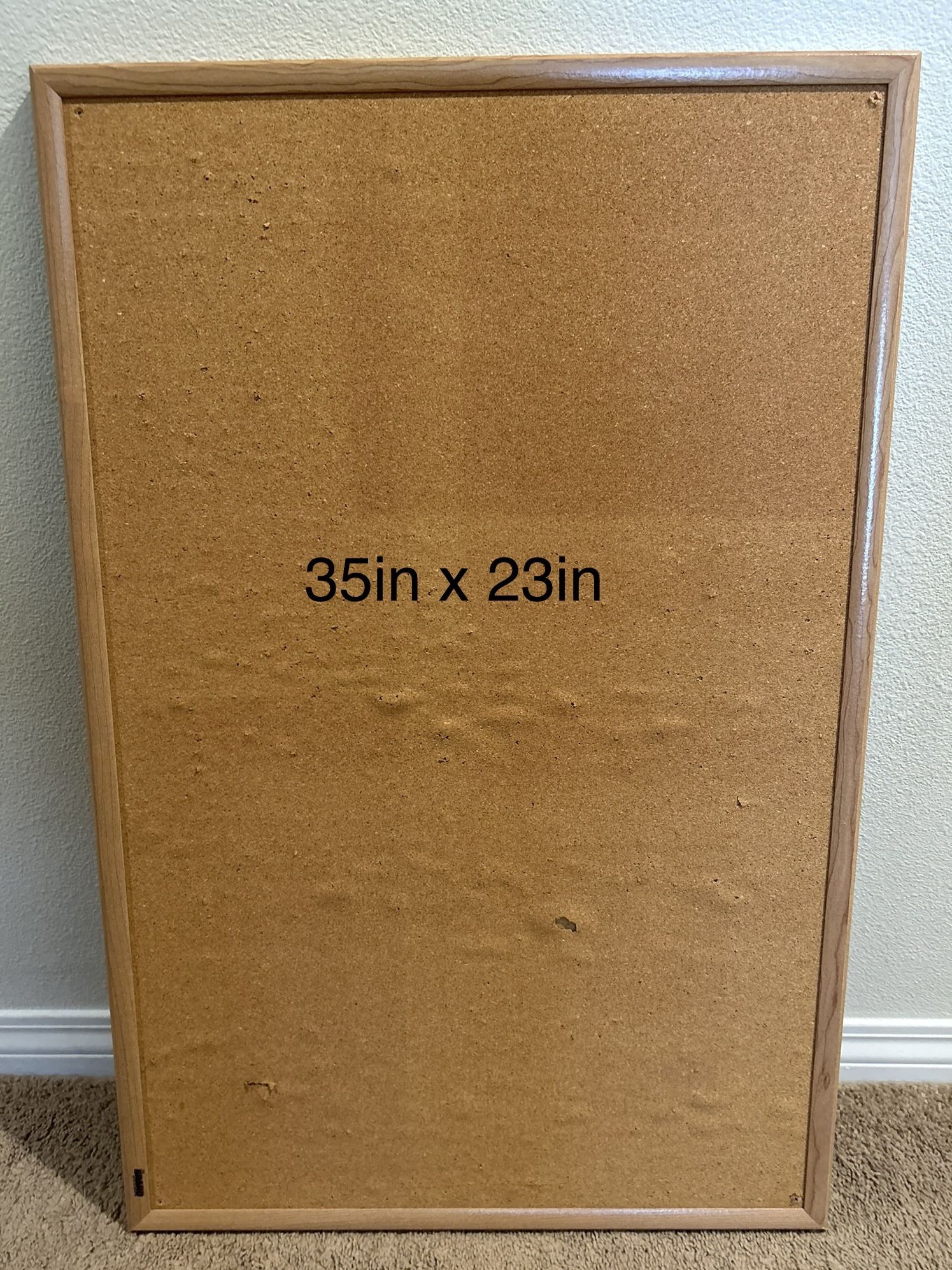 framed cork board 23in x 35in