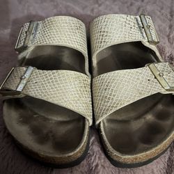 Birkenstock’s Double Strap Metallic Gold/Beige Snake Detail Sandals