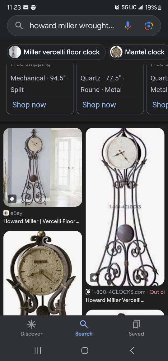 Howard miller rod iron grandfather clock with stone face