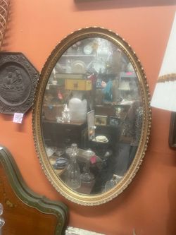Antique gold oval mirror 21 by 32