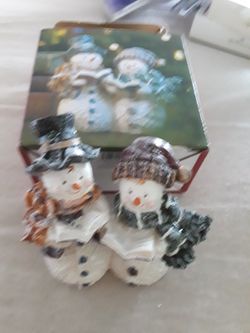 Caroling Mr. And Mrs, Frosty Snowman