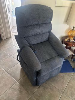La-Z-Boy recliner sit to stand chair navy blue.. 32 inches wide. $350