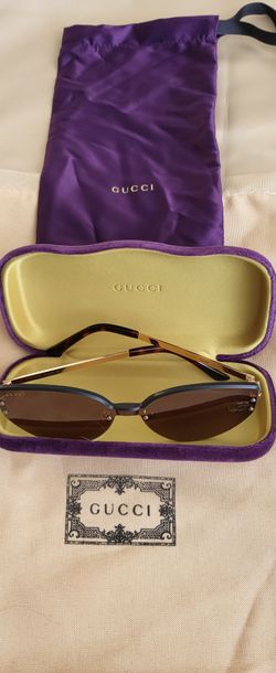 Gafas de sol Gucci sin montura con estuche