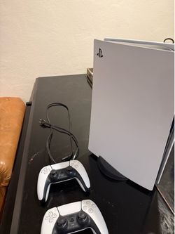 PS5 console and stand  with 2 remotes
