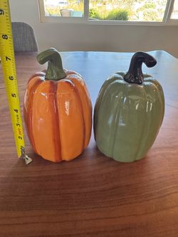 Two ceramic pumpkins.
