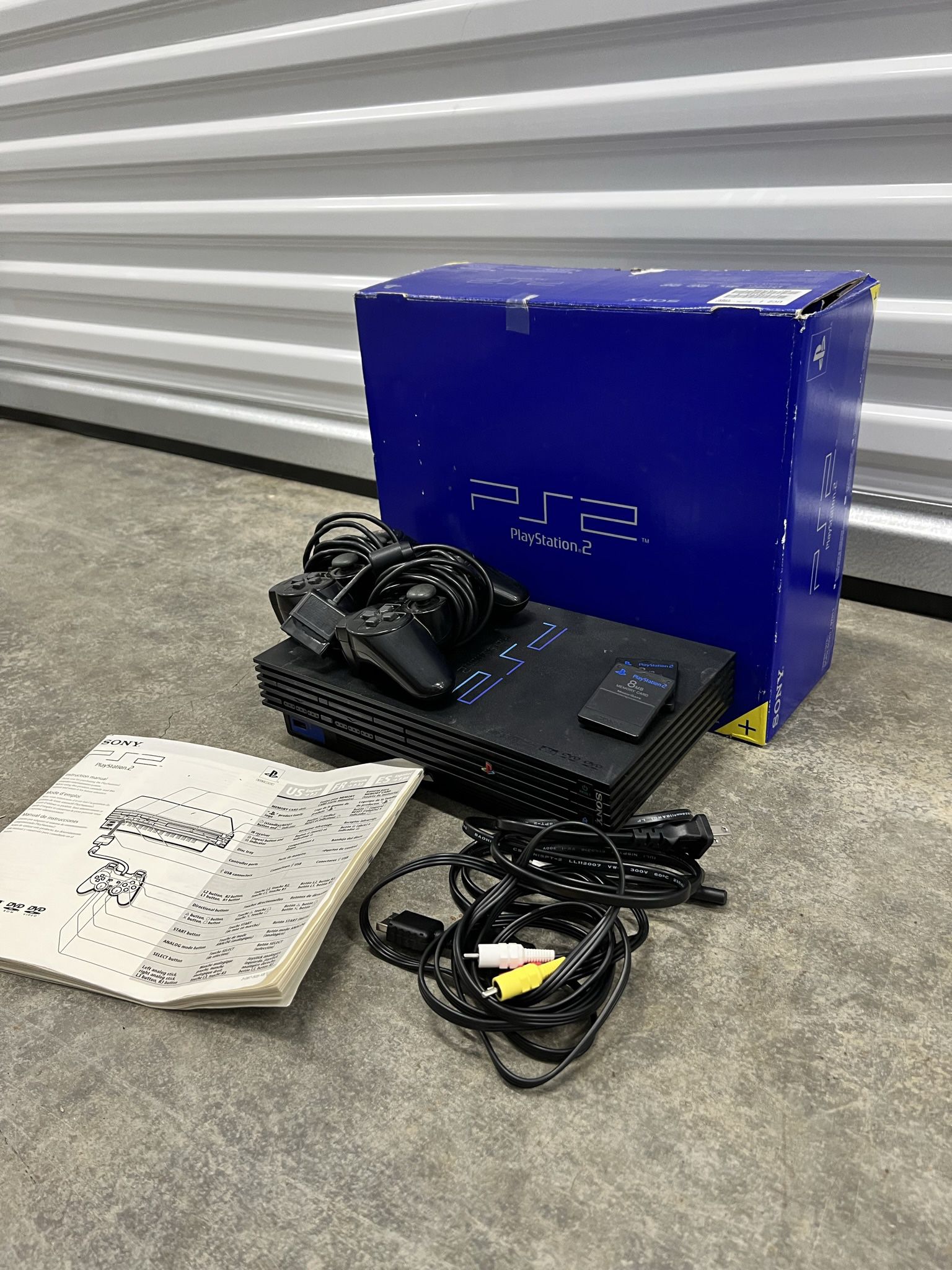 Sony PlayStation 2 with box, 2 dual shock controllers & 2 memory cards included!