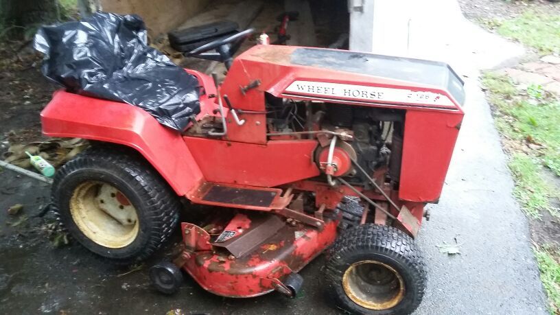 Wheel horse c125 automatic trans,hydraulic lift, 12hp Kohler Motor runs great, comes with mowing deck, snow plow, lawn sweeper ,
