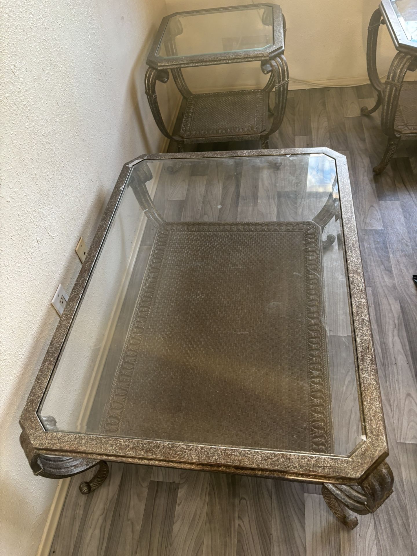 Three tables metal with glass top.