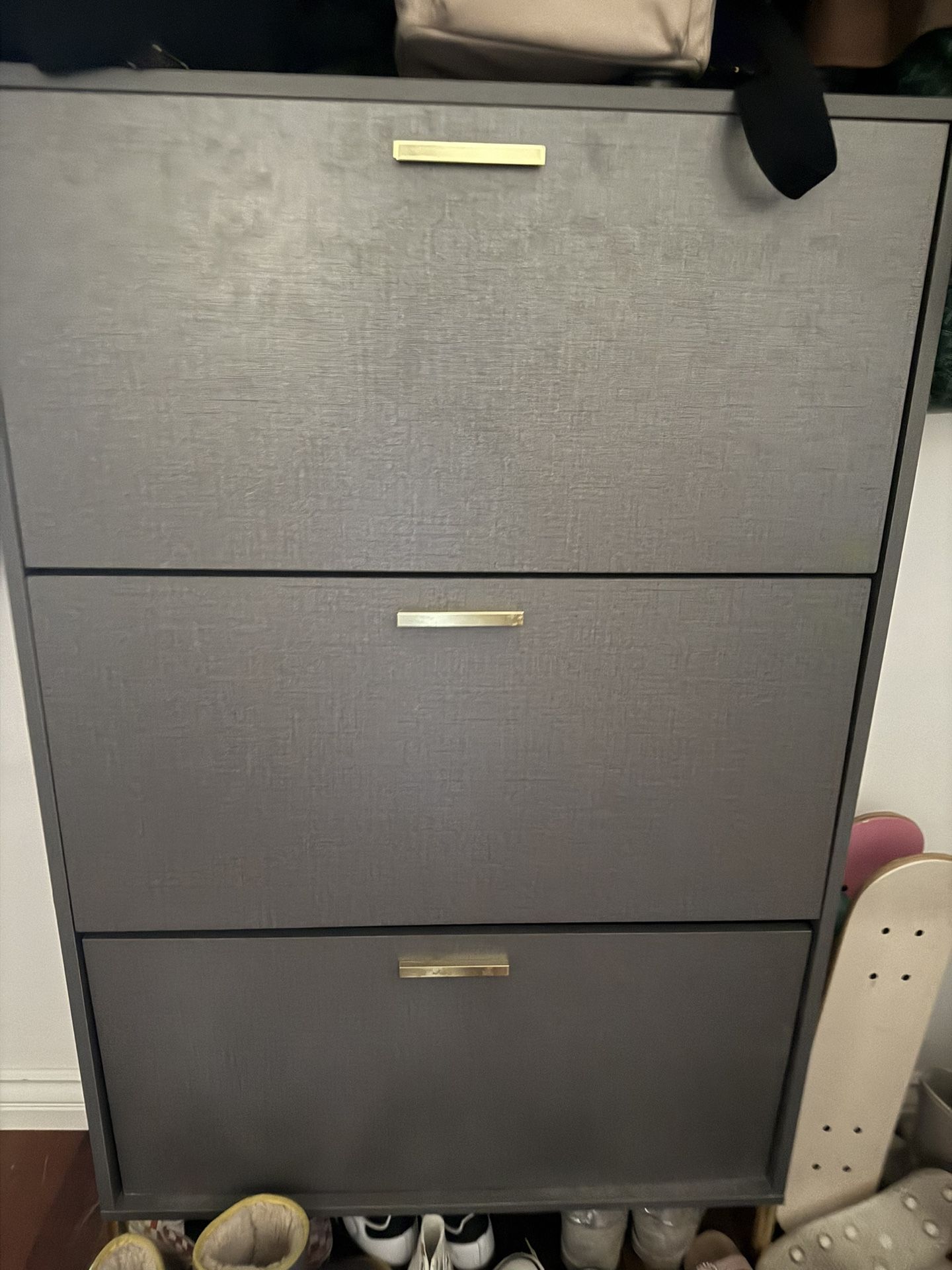Gray Shoe Cabinet With Gold Accents