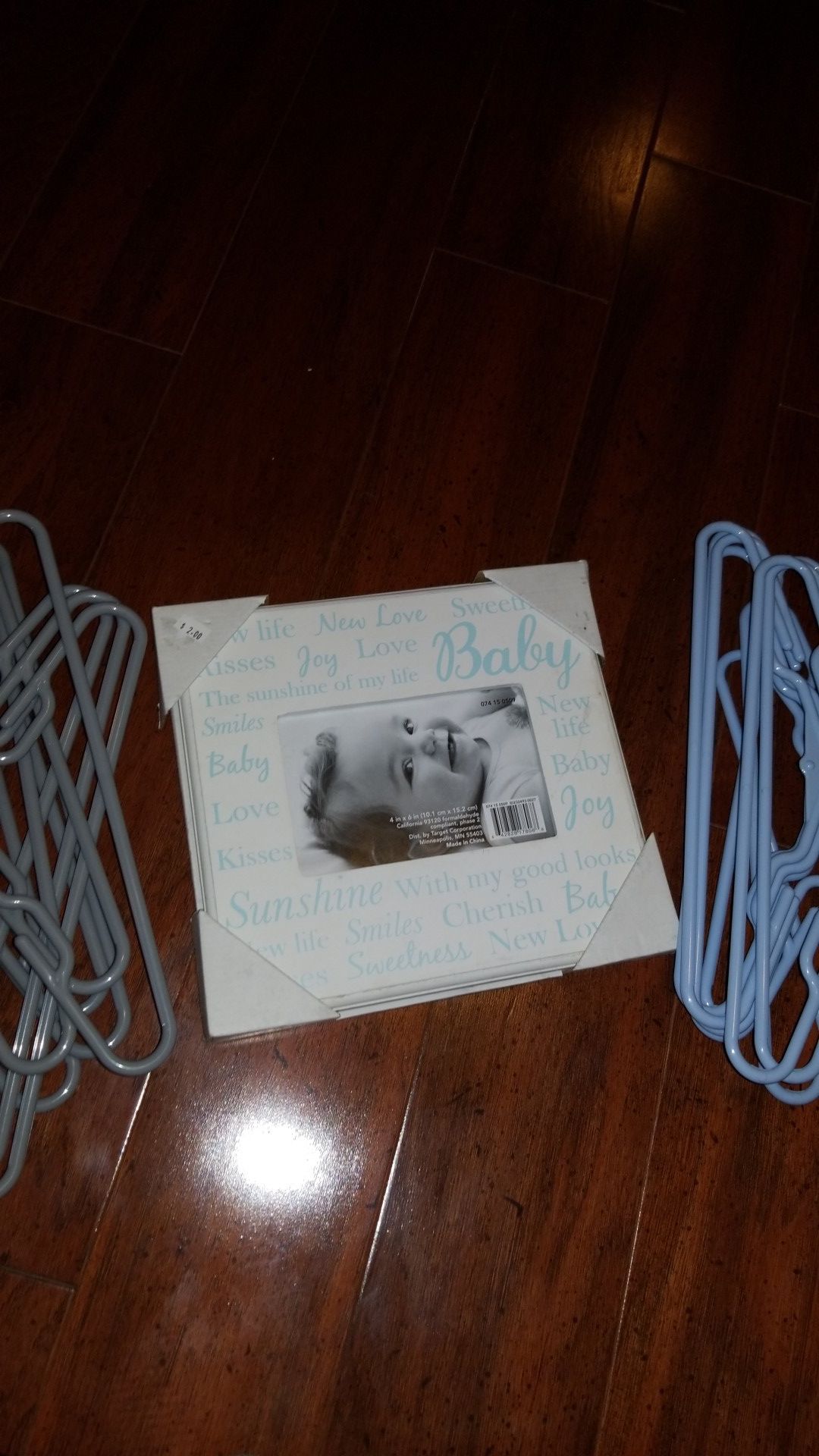 Baby boy photo frame and clothes hangers