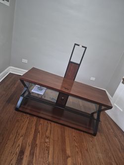 TV stand with brackets holds up to 70 inch