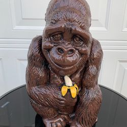 Monkey holding banana statue