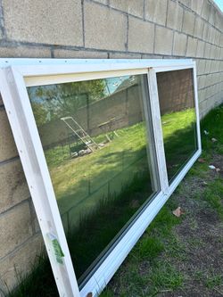 Vinyl Window New 88 by 41 inches with screen