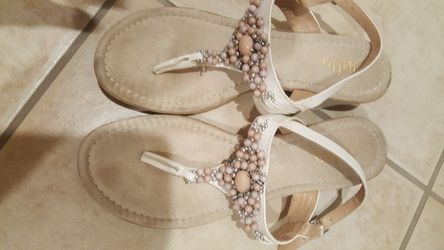 Sandals in size 7with extra cushion for support and beautiful accessories